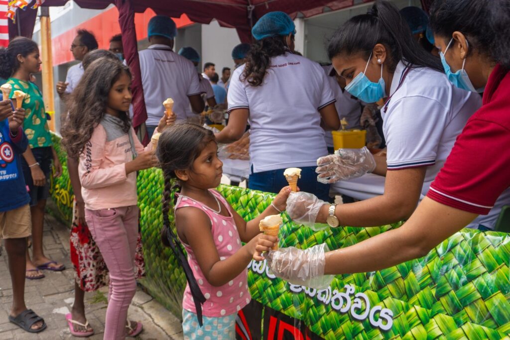 Spreading Joy and Compassion: Ideal Motors Staff Organize Series of Dansala for Vesak and Poson Poya